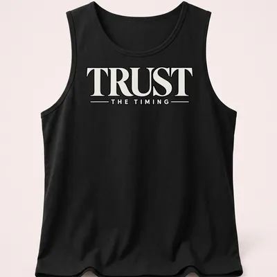 Bold typography shirt featuring the motivational quote 'Trust The Timing' in black and white — printed on a tank top