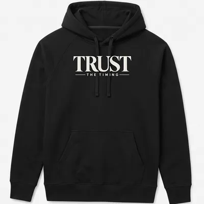Bold typography shirt featuring the motivational quote 'Trust The Timing' in black and white — printed on a unisex hoodie