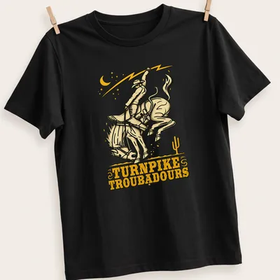 Vintage western t-shirt featuring a cowboy riding a horse with Turnpike Troubadours text — printed on a unisex t-shirt