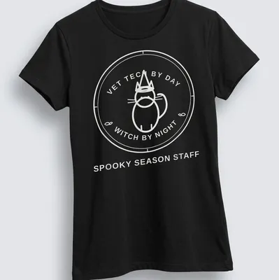 Circular badge design featuring the text Vet Tech By Day Witch By Night with a cat. — printed on a women's shirt