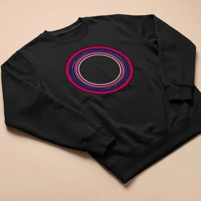 Abstract line art of endless colorful circles in red, purple, green, blue, and black — printed on a unisex sweatshirt
