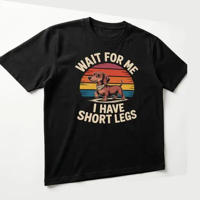 Retro Dachshund t-shirt with humorous text about short legs in warm colors — printed on a unisex t-shirt (angled view)