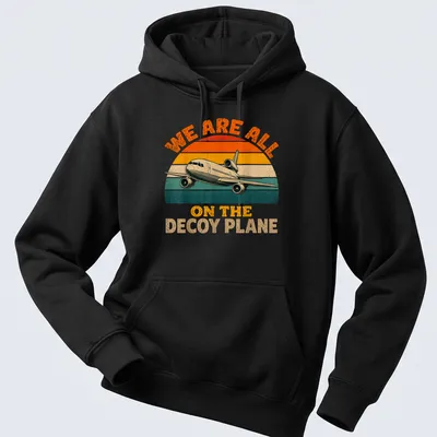 Retro airplane t-shirt with playful text about a decoy plane in vintage colors — printed on a unisex hoodie