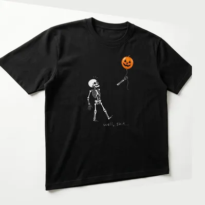 Cartoon skeleton holding a pumpkin balloon with humorous text — printed on a unisex t-shirt (angled view)