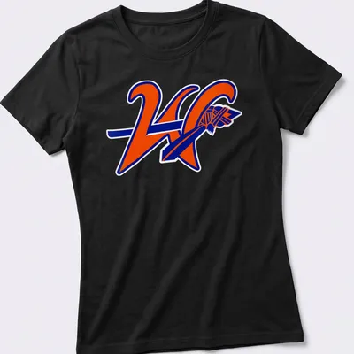 Bold graphic KC logo with text 'Westwood Warriors' in orange and blue — printed on a women's shirt
