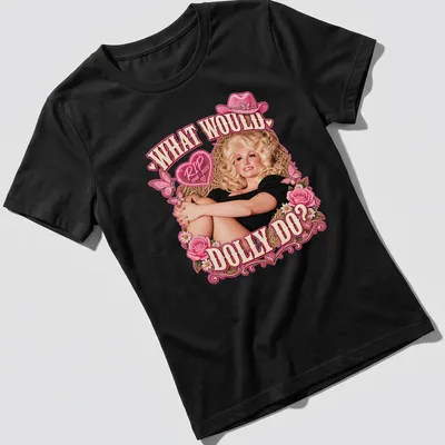 Vintage tribute t-shirt with Dolly Parton illustration and text in pink and black — printed on a women's shirt