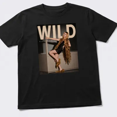 Bold WILD Katseye text above an illustration of a fashion model in gold and black
