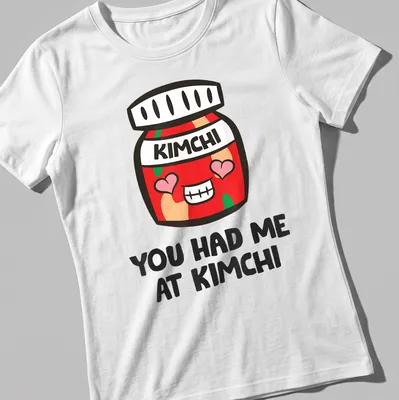 Kawaii-style shirt featuring a cute kimchi jar with joyful text — printed on a women's shirt