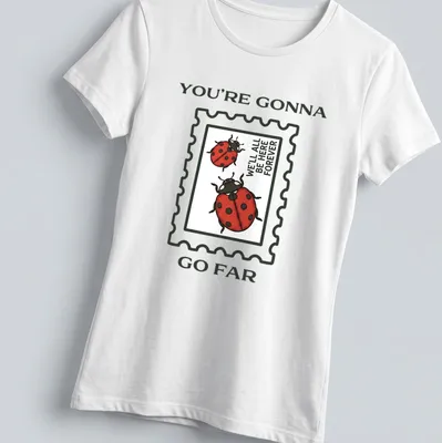 Illustrative T-shirt with ladybugs and encouraging text in red and green — printed on a women's shirt