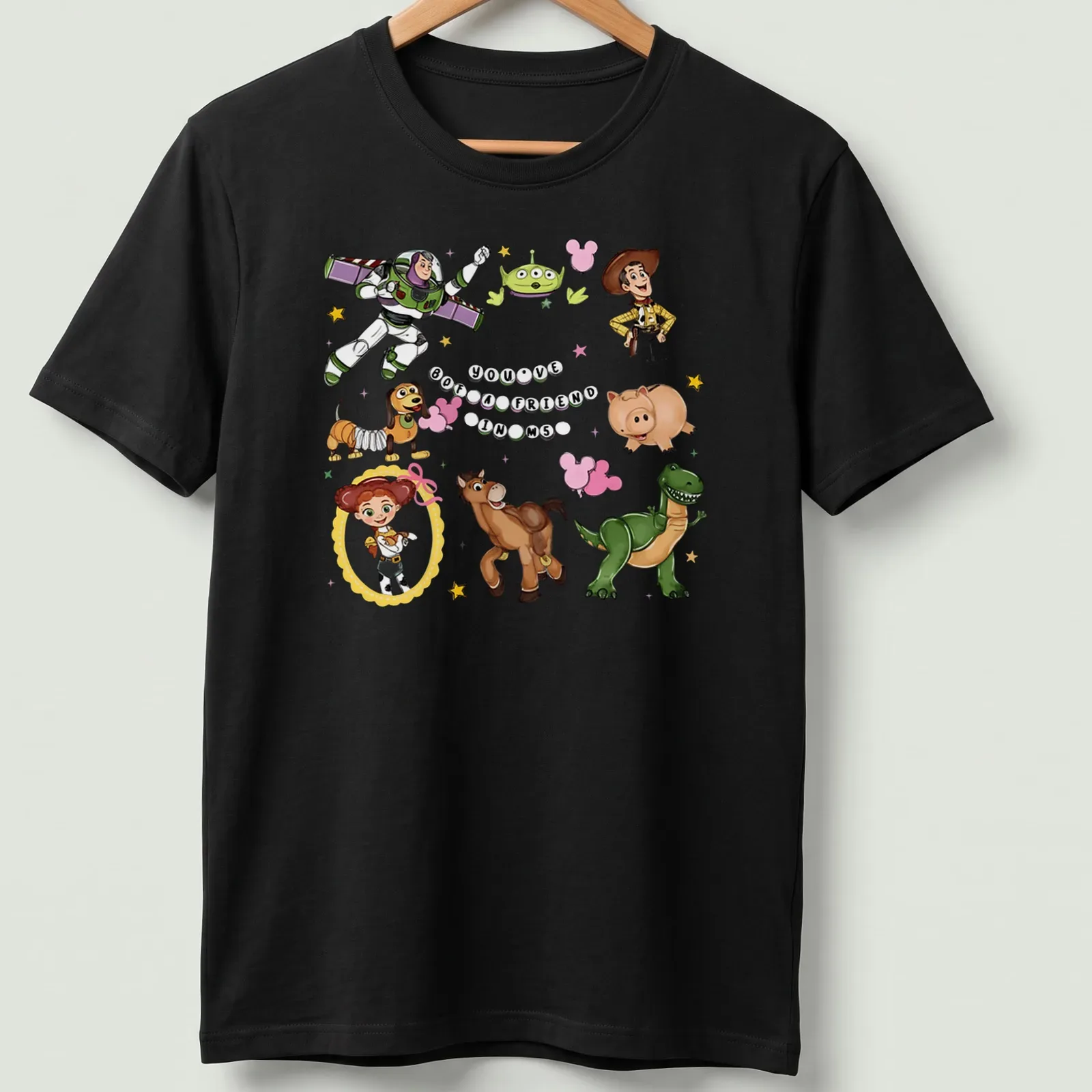 Toy Story characters with colorful cartoon style and printed text about friendship — printed on a unisex t-shirt